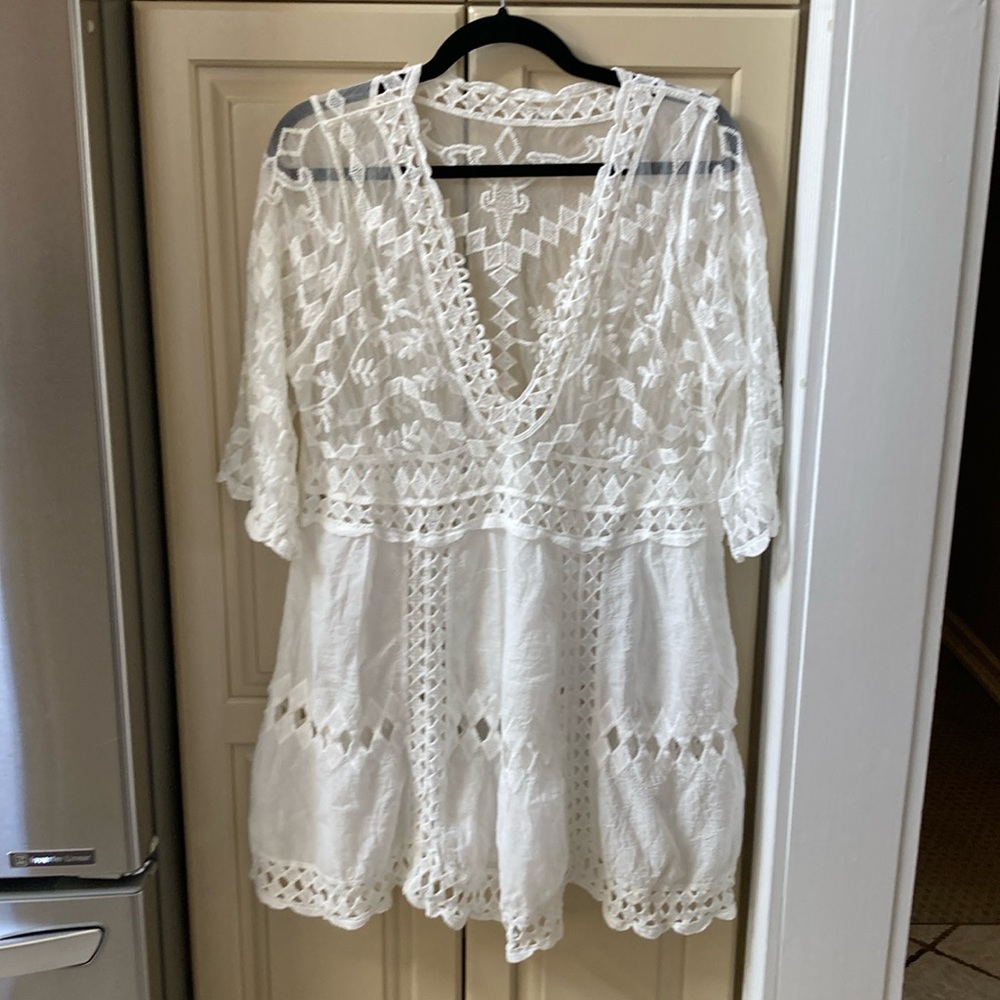 Brand new w/o tags white lace coverup.fits small/medium